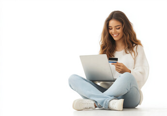 Naklejka premium Young Woman Sitting on Floor with Laptop and Credit Card Against White Background – Online Shopping, E-Commerce, and Digital Payment Concept