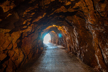 Obraz premium Pedestrian tunnel through a rock or mountain near Petrovac town in winter time, Montenegro