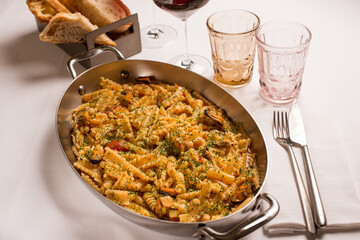 mix of different pasta shapes with mussels tomatoes and oregano