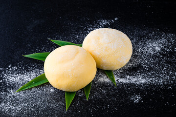 Orange Daifuku mochi dessert stuffed with sweet filling