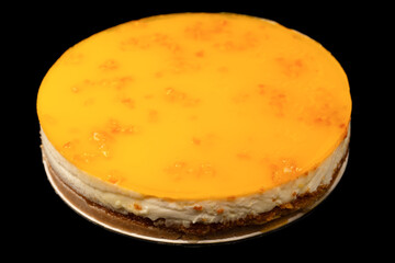 Orange cheesecake isolated on a white background.