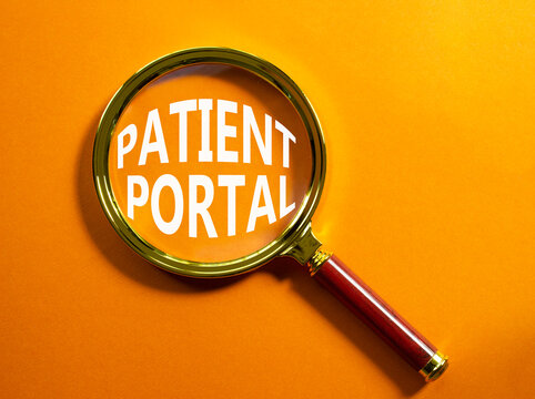 Patient Portal symbol. Magnifying glass with words Patient Portal. Beautiful orange background. Medicine and Patient Portal concept. Copy space.