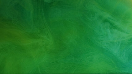 Obraz premium Smoke fume. Ink splash water. Defocused green color paint texture vapor fog mist liquid fluid flow on abstract art light background.