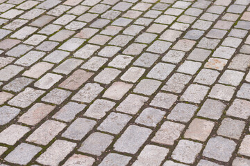Grey tumbled block paving background, texture or pattern