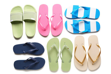 Colorful pairs of female flip flops on white background