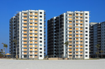 Plywood coverings on beach front condos after numerous hurricanes slams the West Coast of Florida, USA. 