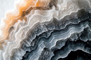 Obraz premium Intricate layers of banded agate, showcasing a mesmerizing blend of light and dark hues, creating a visually stunning landscape.
