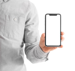 Man holding blank mobile phone on white background, closeup