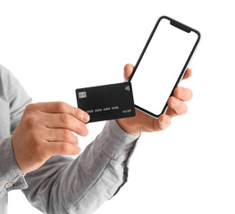 Man holding blank mobile phone and credit card on white background