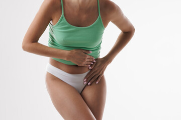 Woman suffering from abdominal pain, menstrual cramps, stomachache, PMS discomfort, digestion...
