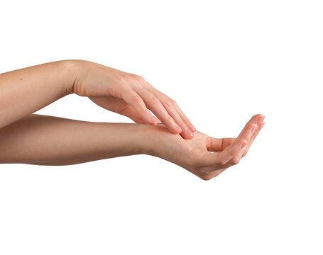 Female hands gently applying moisturizer, with a focus on healthy, well-groomed nails and smooth skin. Symbolizing self-care, beauty, and wellness. Isolated on white background.
