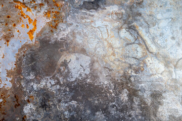 weathered metallic surface with rust
