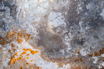 weathered metallic surface with rust