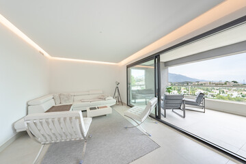an image of a luxury living room with open terrace and views over Marbella 