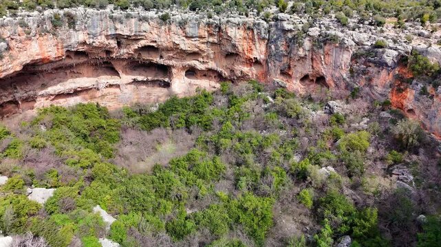 Multiple views of the cennet and cehennem sinkhole, a karst failure located in mersin, turkey, showing its unique geological formation and lush vegetation