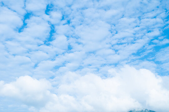 Altocumulus clouds in the blue sky at sunny day ,Blue Sky Background with White Clouds,vast blue sky,little puffy clouds.