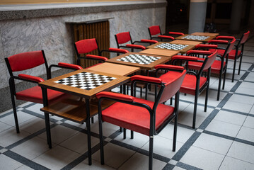 room for competitions and tournaments with checkerboard tables for chess and checkers games