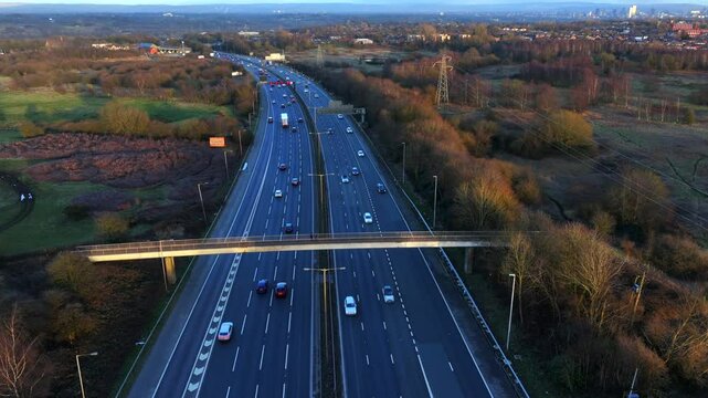 Aerial video of Manchester M60 outer ring road at Sunset