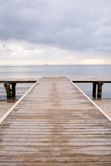Obraz premium Way to the sea on wooden pier in Baltic sea in Sopot, Poland