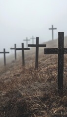 Melancholic Landscape of Wooden Crosses in Foggy Hill Setting