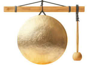 A round golden meditation gong with a wooden mallet resting beside it. PNG transparent.