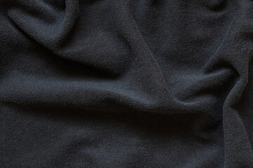 Fototapeta premium Plain black cotton fabric as background , black clothes