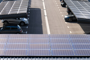 Parking space with solar panels on a roof. Solar canopy