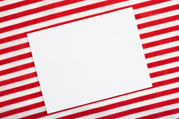 Obraz premium Blank white greeting card with red and white stripes