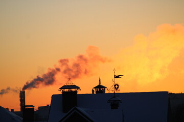 Beautiful sunset and smoke from the chimney