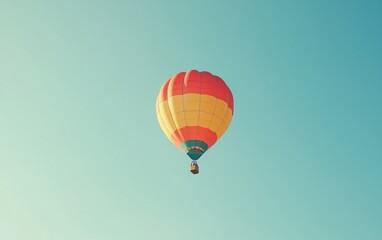 Fototapeta premium Professional stock photo of a Colorful Hot Air Balloon Floating in a Clear Blue Sky