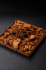 Crispy homemade brown bread chips with seeds and grains