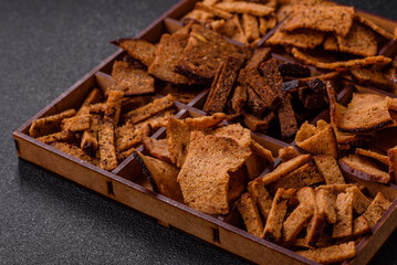 Crispy homemade brown bread chips with seeds and grains