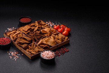 Crispy homemade brown bread chips with seeds and grains