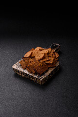 Crispy homemade brown bread chips with seeds and grains