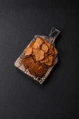 Crispy homemade brown bread chips with seeds and grains