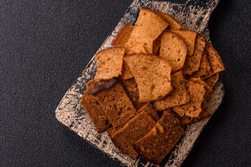 Crispy homemade brown bread chips with seeds and grains