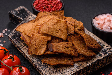 Crispy homemade brown bread chips with seeds and grains