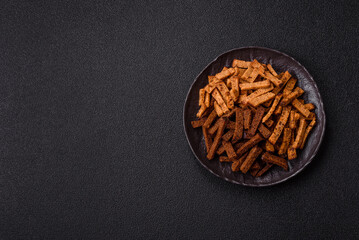 Crispy homemade brown bread crackers or croutons with seeds and grains