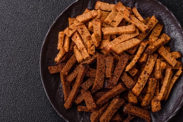 Crispy homemade brown bread crackers or croutons with seeds and grains