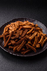 Crispy homemade brown bread crackers or croutons with seeds and grains