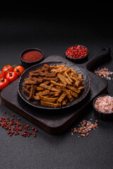 Crispy homemade brown bread crackers or croutons with seeds and grains