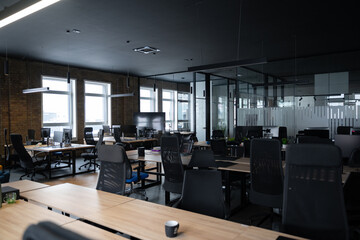 Modern business, glass-walled startup office, open and spacious workspace exudes a modern and innovative vibe, fostering a dynamic atmosphere that supports creativity, collaboration, and business