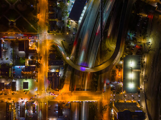 Ventura California Drone Aerial view at Sunset with city Lights appearing near the ocean over 101 traffic freeway