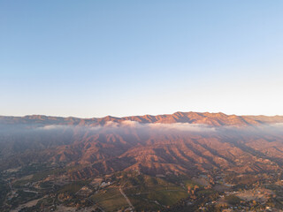 Ojai California aerial Time Lapse shot mountains and mist - Known as the Pink moment before sunset