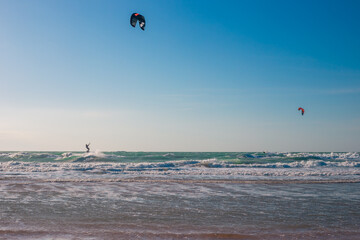 Seascape. Kitesurfer with parachute on water. Active sports recreation