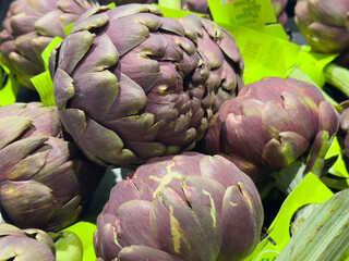 Fresh Purple Artichokes Displayed at Market, Vibrant Colors and Unique Texture Highlighted, Ideal for Culinary Use, Healthy Eating Concept