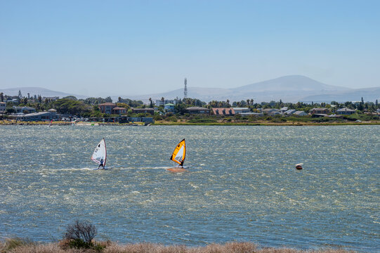 Windsurfing on Rietvlei Dam in Table Bay Nature Reserve &ndash; Thrilling Water Sports in a Scenic Wetland with Mountain Views and Coastal Breeze