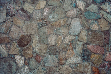Wall of broken stones and concrete