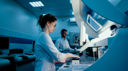 Research scientists work in a laboratory with modern equipment. Analyzes samples and genetic...