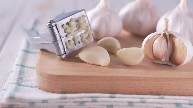 Close-up of garlic bulbs on a wooden table with garlic blur background. Garlic cloves on a table.